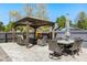 Outdoor space featuring a gazebo with seating, outdoor dining area and privacy fence at 2566 Conway Gardens Rd, Orlando, FL 32806
