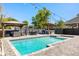 Backyard with inground pool, outdoor seating, a grill, string lights and privacy fence at 2566 Conway Gardens Rd, Orlando, FL 32806