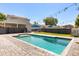 Backyard with inground pool, string lights, and privacy fence at 2566 Conway Gardens Rd, Orlando, FL 32806