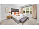 Serene main bedroom with a large window, plush carpeting, and elegant decor for a relaxing retreat at 2619 Corvette Ln, Kissimmee, FL 34746