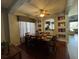 Inviting dining room with dark wood furniture, decorative nooks, and lots of natural light at 2677 Emerald Island Blvd, Kissimmee, FL 34747