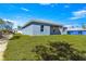 A wide, grassy yard surrounds this single-story home, perfect for outdoor enjoyment and recreation at 2700 Sw 162Nd St Rd, Ocala, FL 34473