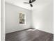 A bright, clean bedroom with wood-look floors, a ceiling fan and a window at 2700 Sw 162Nd St Rd, Ocala, FL 34473