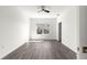 Well-lit bedroom features sleek ceiling fan, with light grey wood-style flooring and neutral walls at 2700 Sw 162Nd St Rd, Ocala, FL 34473
