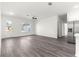 Bright living area with wood-look floors, new stainless refrigerator and exterior view at 2700 Sw 162Nd St Rd, Ocala, FL 34473