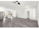 Spacious open-concept living area featuring sleek floors, modern lighting, and a seamless flow into the kitchen at 2700 Sw 162Nd St Rd, Ocala, FL 34473