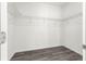 A walk-in closet complete with wire shelving and light grey wood-style flooring at 2700 Sw 162Nd St Rd, Ocala, FL 34473