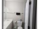 Clean bathroom featuring a single sink vanity, toilet, mirror, and a towel bar at 2706 Club Cortile Cir, Kissimmee, FL 34746