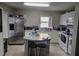 Efficient kitchen featuring an island, stainless steel appliances, and ample counter space at 2706 Club Cortile Cir, Kissimmee, FL 34746