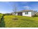 Well-maintained back yard and screened porch with privacy landscaping at 2719 River Creek Ln, St Cloud, FL 34771