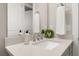 Well-lit bathroom featuring a modern vanity with stone countertop and decorative wreath at 2719 River Creek Ln, St Cloud, FL 34771