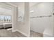 Bright bathroom showing a walk-in shower with a bench and access to the bedroom at 2719 River Creek Ln, St Cloud, FL 34771