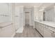 Spacious bathroom with dual vanities, walk-in shower, tile accents, and modern fixtures at 2719 River Creek Ln, St Cloud, FL 34771