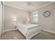 Cozy bedroom with white furniture, wood-look flooring, a ceiling fan, and natural light at 2719 River Creek Ln, St Cloud, FL 34771