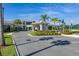 Community clubhouse featuring lush landscaping, a porte-cochere, and elegant design at 2719 River Creek Ln, St Cloud, FL 34771