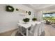 Light-filled dining area with view to outdoor living space at 2719 River Creek Ln, St Cloud, FL 34771