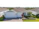 Charming single-story home featuring a brick driveway, two-car garage and meticulously landscaped front yard at 2719 River Creek Ln, St Cloud, FL 34771