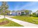Beautiful single-story home featuring a brick driveway, two-car garage and meticulously landscaped front yard at 2719 River Creek Ln, St Cloud, FL 34771