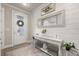 Tastefully decorated entryway features a white console table, decorative mirror, and stylish accents at 2719 River Creek Ln, St Cloud, FL 34771