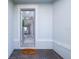 Bright entryway with an open door and view of the living room, highlighting the home's welcoming interior at 2719 River Creek Ln, St Cloud, FL 34771