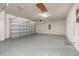 Clean garage with gray epoxy flooring and door on the left at 2719 River Creek Ln, St Cloud, FL 34771