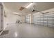 Spacious garage with epoxy flooring and garage doors in the rear at 2719 River Creek Ln, St Cloud, FL 34771