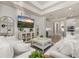 Cozy living room with shiplap walls, recessed lighting, and a view into the kitchen area at 2719 River Creek Ln, St Cloud, FL 34771