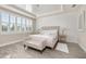 Serene bedroom showcasing natural light, wood-look floors, and an elegant chandelier at 2719 River Creek Ln, St Cloud, FL 34771