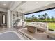 Inviting outdoor living area with comfortable seating, built-in grill, and scenic backyard views at 2719 River Creek Ln, St Cloud, FL 34771