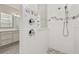 Close-up of the beautiful walk-in shower featuring white subway tile and decorative accents at 2719 River Creek Ln, St Cloud, FL 34771