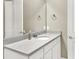 Well-lit bathroom vanity featuring white cabinets and a marble countertop at 2768 Matera Dr, St Cloud, FL 34771