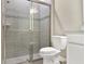 Modern bathroom showcasing tiled shower with glass doors and neutral colors at 2768 Matera Dr, St Cloud, FL 34771