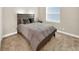 A cozy bedroom featuring carpet, natural light, and minimalist decor at 2768 Matera Dr, St Cloud, FL 34771