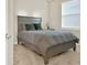Cozy bedroom showcasing a stylish gray bed frame and neutral decor at 2768 Matera Dr, St Cloud, FL 34771