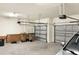 Spacious two car garage with two steel doors and two trash receptacles at 2768 Matera Dr, St Cloud, FL 34771