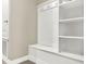 Bright mudroom boasting white cabinetry, hooks, and built-in shelving at 2768 Matera Dr, St Cloud, FL 34771