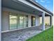 Back patio with a brick floor and ceiling overhang at 2768 Matera Dr, St Cloud, FL 34771