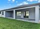 This home features a covered patio with brick floor and sliding glass doors to the interior living space at 2768 Matera Dr, St Cloud, FL 34771