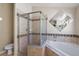 Bathroom featuring tiled walk-in shower and soaking tub at 2804 Latter Day Ct, St Cloud, FL 34769