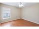 Bedroom featuring a window with blinds and laminate flooring at 2804 Latter Day Ct, St Cloud, FL 34769