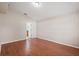 Bright bedroom featuring wood floors, neutral walls, and ensuite bath access at 2804 Latter Day Ct, St Cloud, FL 34769