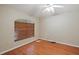 Cozy bedroom with wood floors, neutral walls, and natural light from the window at 2804 Latter Day Ct, St Cloud, FL 34769