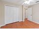 Bedroom with ceiling fan, double closets and view to the hallway at 2804 Latter Day Ct, St Cloud, FL 34769