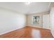 Well-lit bedroom featuring laminate flooring and a large window at 2804 Latter Day Ct, St Cloud, FL 34769