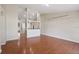 Spacious living room with wood-look flooring and ample natural light, perfect for entertaining at 2804 Latter Day Ct, St Cloud, FL 34769