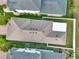 Birds eye view of roof, screened-in patio, and surrounding yard at 3005 Crispin Cir, Harmony, FL 34773