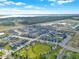 Wonderful aerial view captures a harmonious blend of residential living, green spaces, and recreational areas in the community at 3005 Crispin Cir, Harmony, FL 34773
