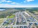 Aerial view of the community with a lake and wetlands at 3005 Crispin Cir, Harmony, FL 34773