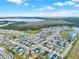 Aerial view of the community featuring a lake and wooded area at 3005 Crispin Cir, Harmony, FL 34773