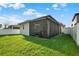 A view of the backyard and screened-in patio at 3005 Crispin Cir, Harmony, FL 34773